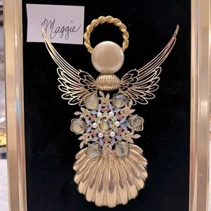 Angel Maggie was created in beautiful, gold pearl, and a colorful brooch